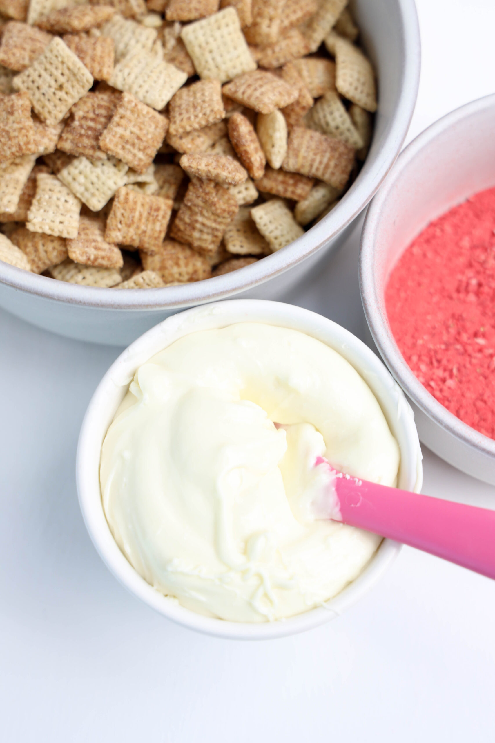 Smooth, melted white chocolate in a bowl, ready for mixing.